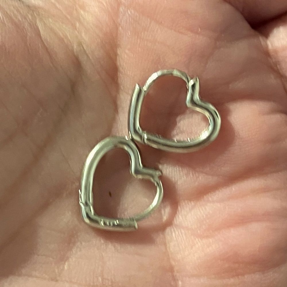 The Dainty Heart Huggie mini hoop earrings in 925 silver